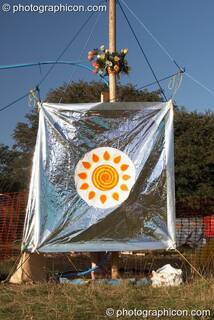 A person takes uses the solar showers at Big Green Gathering 2007. Burrington, Cheddar, Great Britain. © 2007 Photographicon