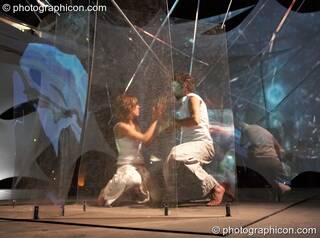 Mira WeMoonSpiral and Tom Peto of Arcescape perform a dance of light on the IDSpiral outdoor stage at Glade Festival 2006. Aldermaston, Great Britain. © 2006 Photographicon