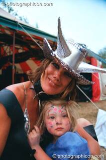 Mother and daughter in the Lost Vaguess field at Glastonbury Festival 2002. Pilton, Great Britain. © 2002 Photographicon
