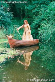 Wicker sculpture of a lady in a boat on a river at Glastonbury Festival 2003. Pilton, Great Britain. © 2003 Photographicon