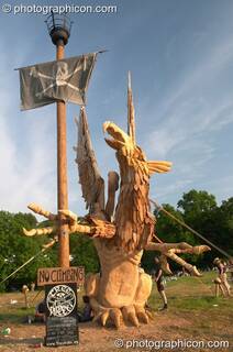 The Tree Pirates Griffon chainsaw sculpture in the King's Meadow at Glastonbury Festival 2005. Pilton, Great Britain. © 2005 Photographicon