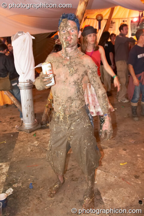 A man person covered in mud and straw at the Secret Garden Party 2006. Huntingdon, Great Britain. © 2006 Photographicon