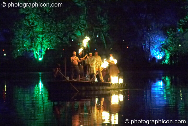 Archers on a small boat near the Galleon prepare their flaming arrows at the Secret Garden Party 2008. Huntingdon, Great Britain. © 2008 Photographicon