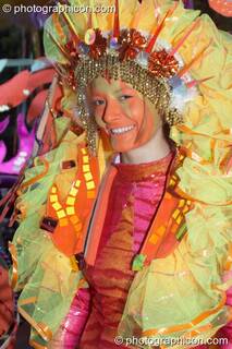Woman in colourful stylised Native American headdress participates in the carnival at the Thames Festival 2005. London, Great Britain. © 2005 Photographicon