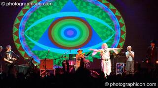Miquette Giraudy, Steve Hillage, Gilli Smyth, Chris Taylor, Daevid Allen, Mike Howlett, and Theo Travis of Planet Gong perform at the Kentish Town Forum with visual projections by ColourSound. London, Great Britain. © 2009 Photographicon