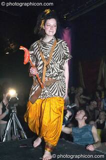 Woman stands on the catwalk modelling for an ethical fashion show at The Synergy Project. London, Great Britain. © 2005 Photographicon