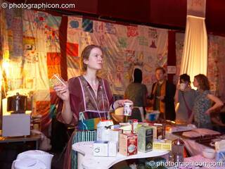 A woman serves tea at the cafe in the Speak space at The Synergy Project. London, Great Britain. © 2006 Photographicon