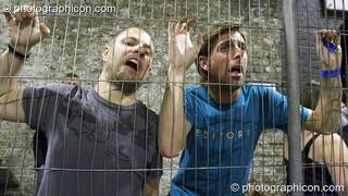 Nico & Stu attempt to escape from the smoker's cage outside The Synergy Project. London, Great Britain. © 2007 Photographicon
