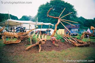 Dinosaur Park chainsaw sculpture by the Tree Pirates at Big Green Gathering 2003. Cheddar, Great Britain. © 2003 Photographicon