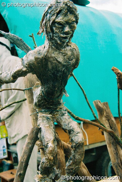 A small sculpture of a leaping man at Big Green Gathering 2003. Cheddar, Great Britain. © 2003 Photographicon