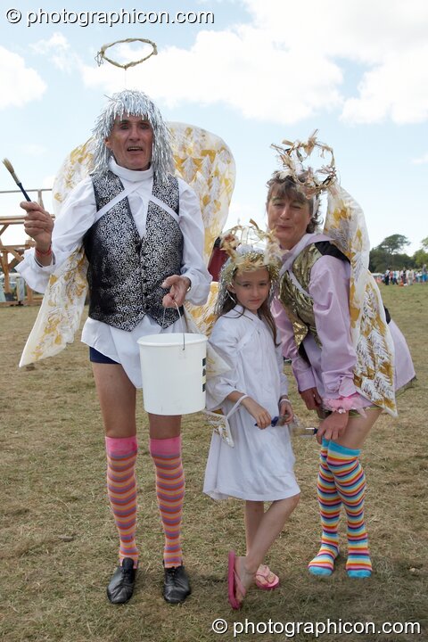 Man, woman, and child dressed as angels at Big Green Gathering 2005. Burrington, Cheddar, Great Britain. © 2005 Photographicon