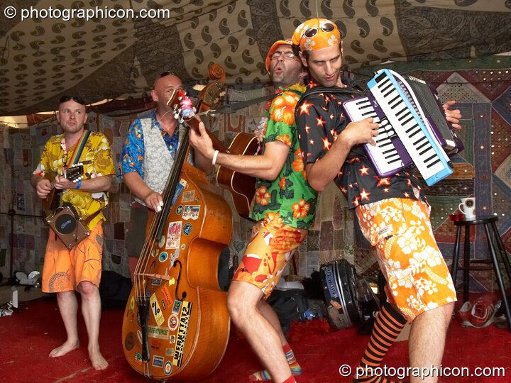 The Cosmic Sausages playing in the Bedouin Cafe at Big Green Gathering 2006. Burrington, Cheddar, Great Britain. © 2006 Photographicon