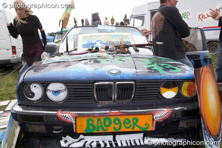 A decoratively painted BMW car forms part of an art stall at Big Green Gathering 2007. Burrington, Cheddar, Great Britain. © 2007 Photographicon