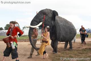 A circus troop lead a pantomime elephant around Big Green Gathering 2007. Burrington, Cheddar, Great Britain. © 2007 Photographicon