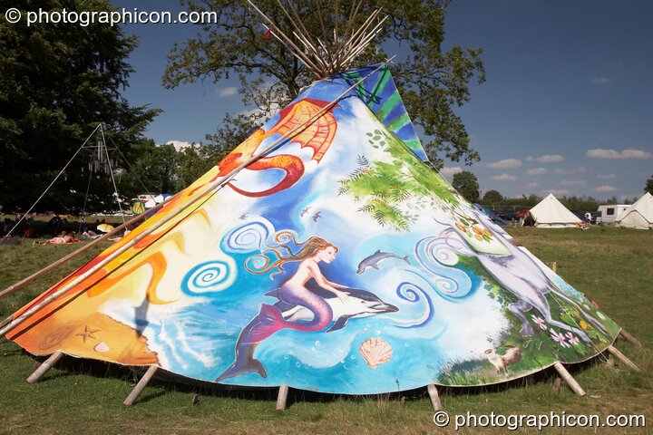 A beautifully painted with scenes of mythic creatures on a tipi in the Healing Field at Big Green Gathering 2007. Burrington, Cheddar, Great Britain. © 2007 Photographicon