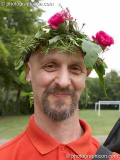 Man wearing a flower head-dress at the Feast of the Magdalene. Glastonbury, Great Britain. © 2005 Photographicon