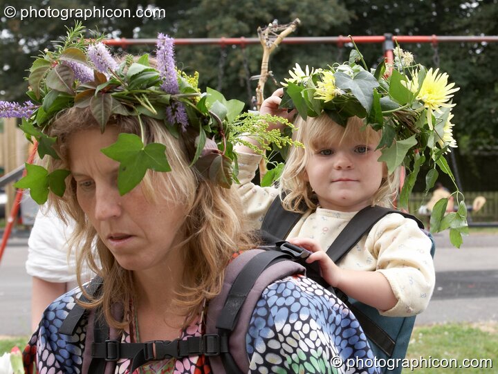 Woman and child wearing a flower head-dress at the Feast of the Magdalene. Glastonbury, Great Britain. © 2005 Photographicon