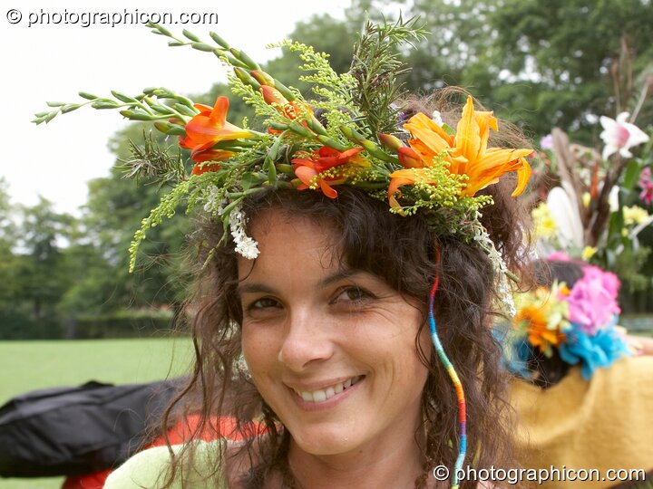 Woman wearing a flower head-dress at the Feast of the Magdalene. Glastonbury, Great Britain. © 2005 Photographicon