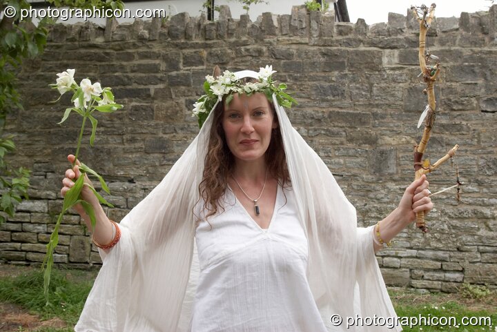 Woman wearing a flower head-dress at the Feast of the Magdalene. Glastonbury, Great Britain. © 2005 Photographicon