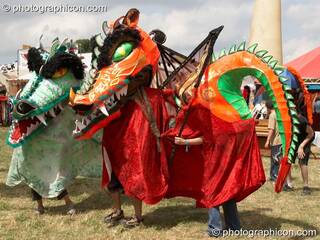 Colourful carnival dragons on parade at Glade Festival 2005. Aldermaston, Great Britain. © 2005 Photographicon