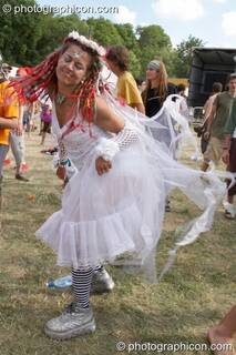 Dreaded girl in white fairy dress dances by the Origin Stage at Glade Festival 2005. Aldermaston, Great Britain. © 2005 Photographicon