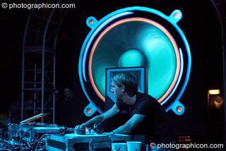 Richie Hawtin performs with his head profiled by a giant painted speaker backdrop on the Vapor Stage at Glade Festival 2007. Aldermaston, Great Britain. © 2007 Photographicon