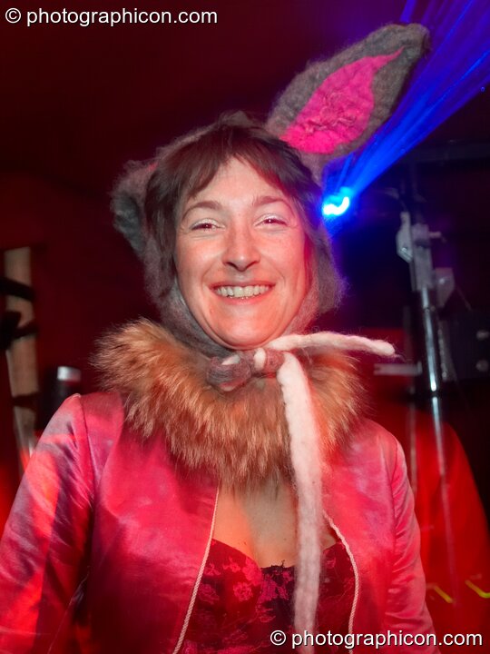 A woman wearing a rabbit costume dances in the secret space Down The Rabbit Hole at Glade Festival 2011. King's Lynn, Great Britain. © 2011 Photographicon