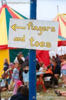 Fingers and toes sign at Glastonbury Festival 2002. Pilton, Great Britain. © 2002 Photographicon
