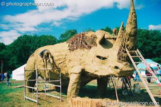 Large wicker and mud sculpture of a rhino in the Green Futures field at Glastonbury Festival 2003. Pilton, Great Britain. © 2003 Photographicon