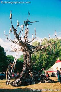 A tree sculpture made from car exhaust pipes in the Lost Vagueness field at Glastonbury Festival 2003. Pilton, Great Britain. © 2003 Photographicon