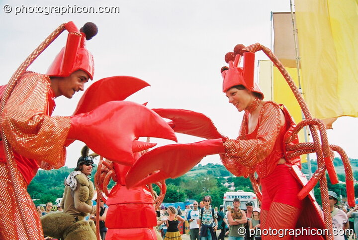 Man and woman dressed in lobster outfits at Glastonbury Festival 2003. Pilton, Great Britain. © 2003 Photographicon
