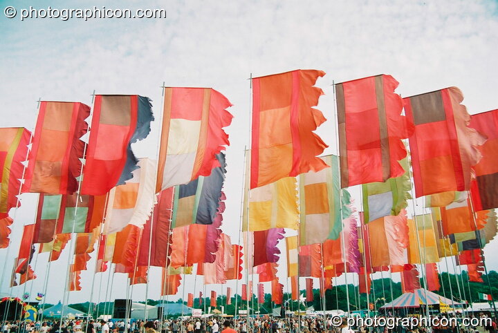 Many large flags decorate the Jazz Field at Glastonbury Festival 2003. Pilton, Great Britain. © 2003 Photographicon