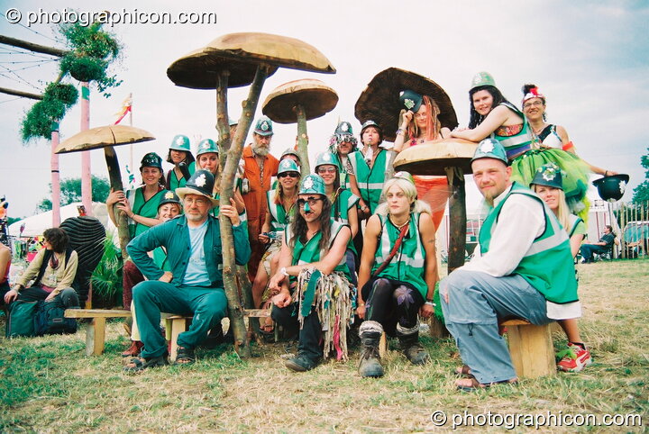 Group photo of the Green Police amongst the mushrooms at Glastonbury Festival 2003. Pilton, Great Britain. © 2003 Photographicon