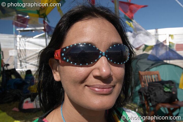 The smile of an off-duty Green Police woman at Glastonbury Festival 2004. Pilton, Great Britain. © 2004 Photographicon