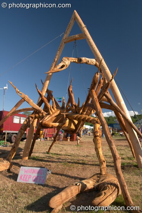 The Tree Pirates 25 foot scorpion chainsaw sculpture at Glastonbury Festival 2004. Pilton, Great Britain. © 2004 Photographicon