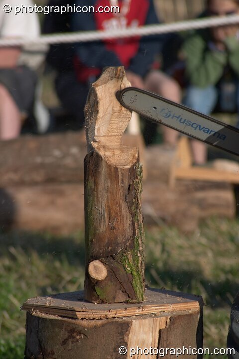 Vandweller tree sculptures being made with a chainsaw at Glastonbury Festival 2004. Pilton, Great Britain. © 2004 Photographicon