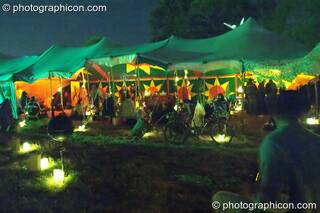 Outside the Small World Stage by candle light at Glastonbury Festival 2004. Pilton, Great Britain. © 2004 Photographicon