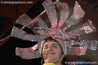 A man wearing a mirror hat in the Lost Vagueness Casino at Glastonbury Festival 2004. Pilton, Great Britain. © 2004 Photographicon