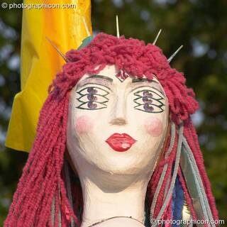 Female mannequin with pink hair and six eyes in the Green Crafts field at Glastonbury Festival 2005. Pilton, Great Britain. © 2005 Photographicon