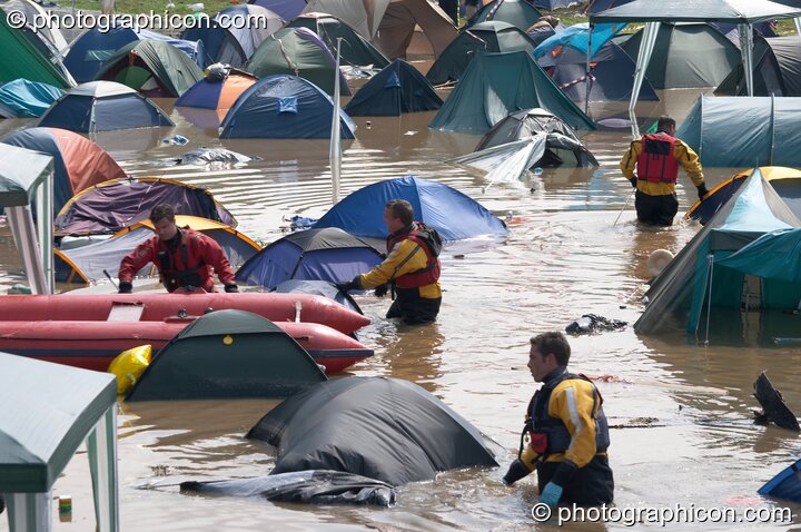 Somerset Fire Brigade search partially submerged tents after the Pennard Hill camp site flooded at Glastonbury Festival 2005. Pilton, Great Britain. © 2005 Photographicon