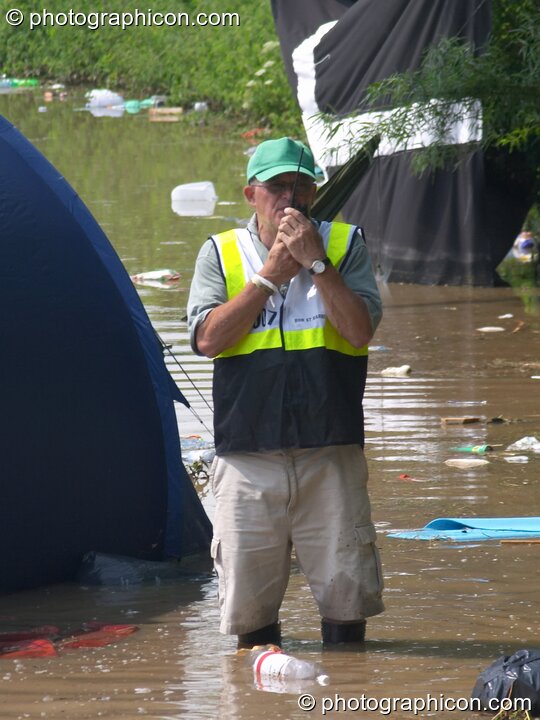 Festival site manager, Bob st Barb, in waders after the Pennard Hill camp site flooded at Glastonbury Festival 2005. Pilton, Great Britain. © 2005 Photographicon