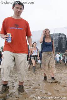 People walking through a lake of mud around the Other Stage at Glastonbury Festival 2005. Pilton, Great Britain. © 2005 Photographicon