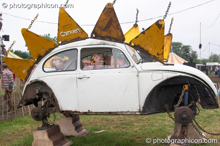 Mutoid Waste Company sculpture of a family of crash-test dummies in a VW Beetle at Glastonbury Festival 2005. Pilton, Great Britain. © 2005 Photographicon