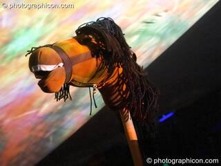 A toy horse head in front of projection screen in the idSpiral dome (Dance Village) at Glastonbury Festival 2005. Pilton, Great Britain. © 2005 Photographicon