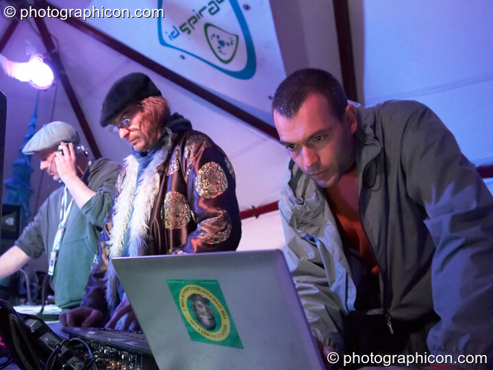 Jon More, Matt Black, and Mathieu Hourteillan of Coldcut perform an AV set on the ID Spiral stage in the Dance Village at Glastonbury Festival 2007. Pilton, United Kingdom. © 2007 Photographicon