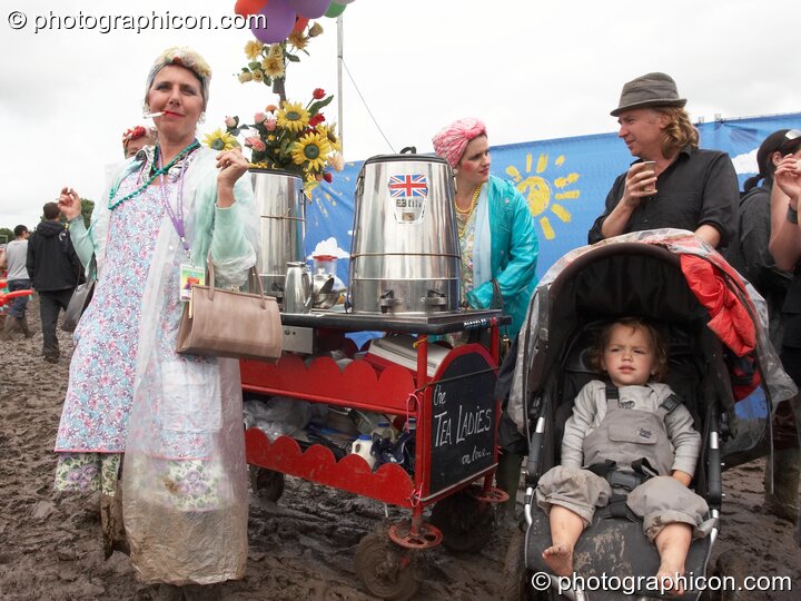 Two ladies sell tea from a trolley at Glastonbury Festival 2007. Pilton, United Kingdom. © 2007 Photographicon