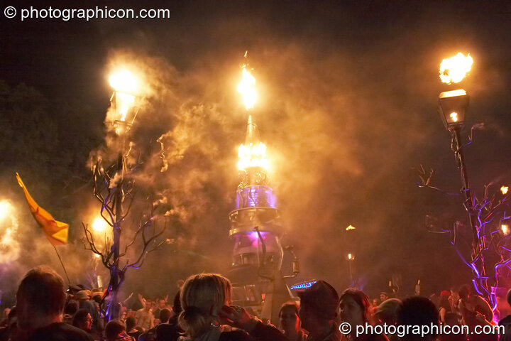 Fire and smoke leap from the Mutoid Waste's Arcadia Installation while Merv Pepler of Eat Static DJs in Trash City at Glastonbury Festival 2008. Pilton, Great Britain. © 2008 Photographicon