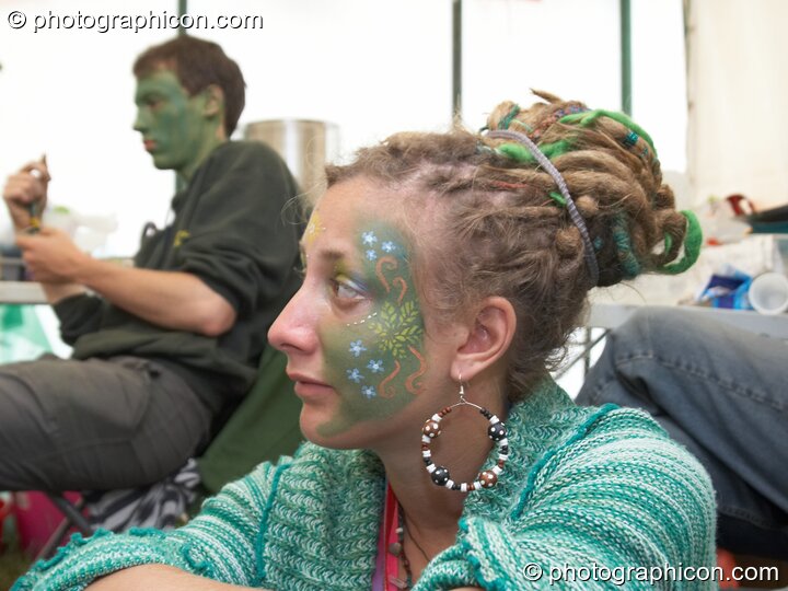 Portrait of a Green Police officer as they prepare their costume, with face painting by Simone Kay &amp; her team, at Glastonbury Festival 2008. Pilton, Great Britain. © 2008 Photographicon