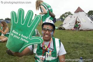 A Green Police officer with large foam hands at Glastonbury Festival 2008. Pilton, Great Britain. © 2008 Photographicon