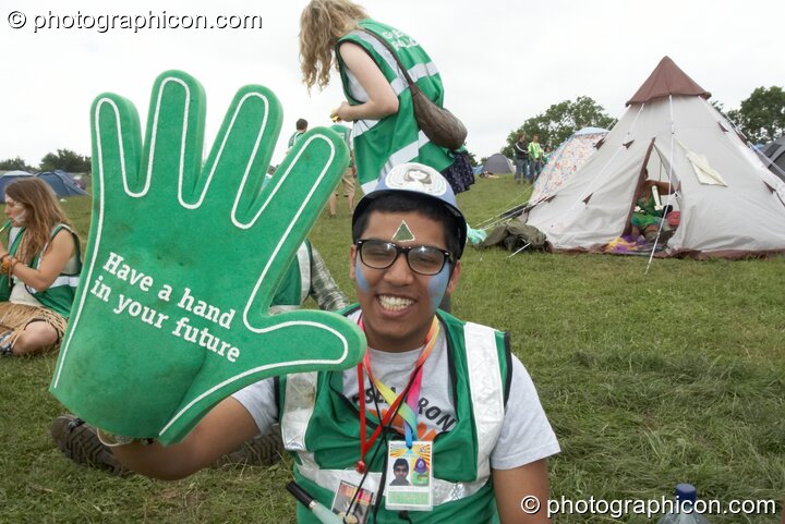 A Green Police officer with large foam hands at Glastonbury Festival 2008. Pilton, Great Britain. © 2008 Photographicon